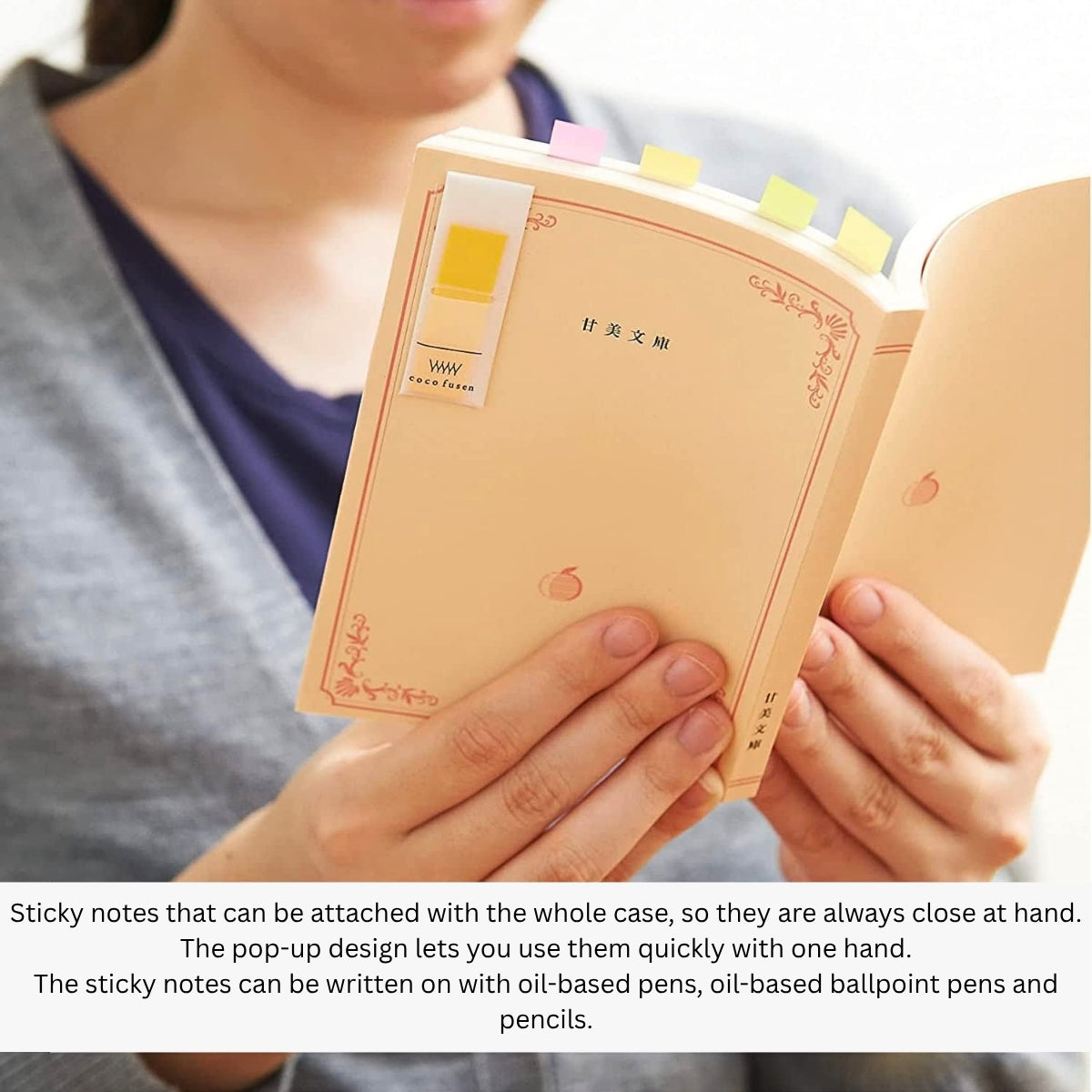 Hands holding Kanmido Kokofusen Pattern sticky notes attached to small notebooks for organisation.
