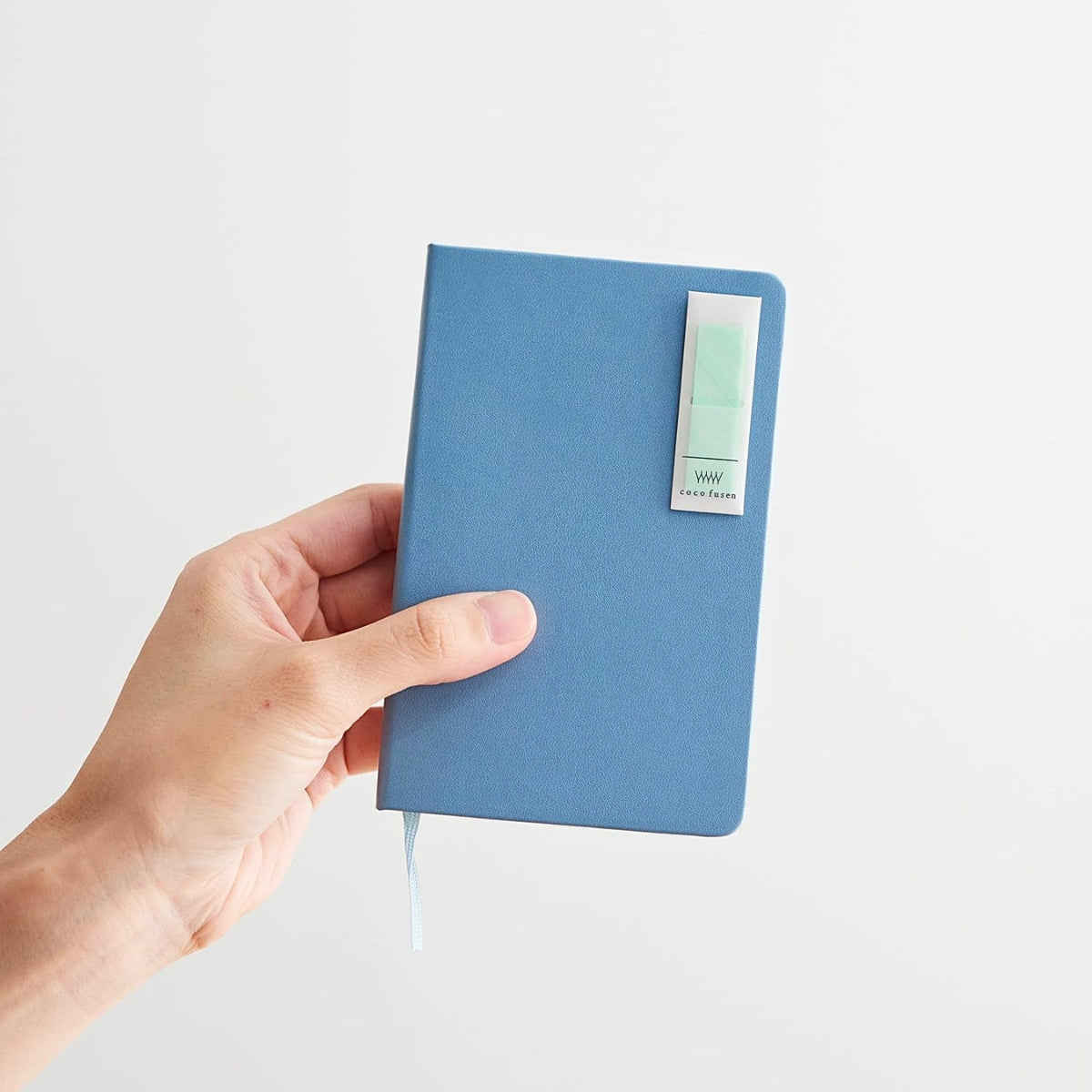 Kanmido Kokofusen Pattern sticky notes clipped neatly onto a notebook cover for quick access.